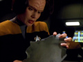 Torres untersucht ein Fragment von Chakotays Shuttle.jpg
