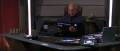 Picard sitzt am Schreibtisch und liest auf PADD.jpg