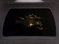 USS Defiant feuert Quantentorpedos auf klingonisches Transportschiff.jpg