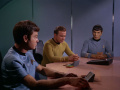 McCoy und Spock sind etwas überrascht als Kirk Garrovick vom Dienst suspendiert.jpg